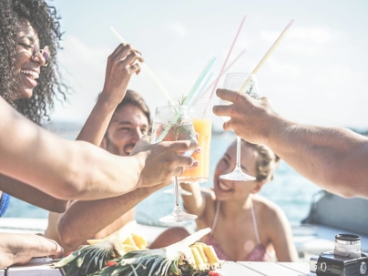 a group of friends drinking on a boat